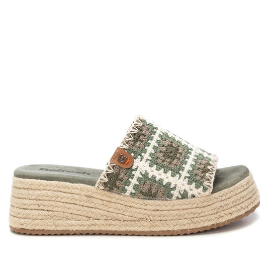 A stylish platform sandal featuring a woven green and white strap, a thick jute-wrapped sole, and a small brown logo tag on the side—these vegan-friendly Khaki Wedge Sandals are perfect for any summer outing.