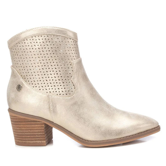 Beige ladies’ ankle boots with a stacked heel, perforated upper design and pointed toe offer a subtle cowboy-inspired look for versatile styling.