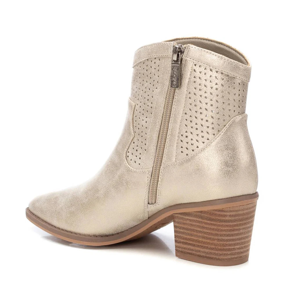 A metallic gold ladies’ ankle boot with a side zip, perforated upper design, and stacked block heel adds a bold metallic sheen to any outfit.