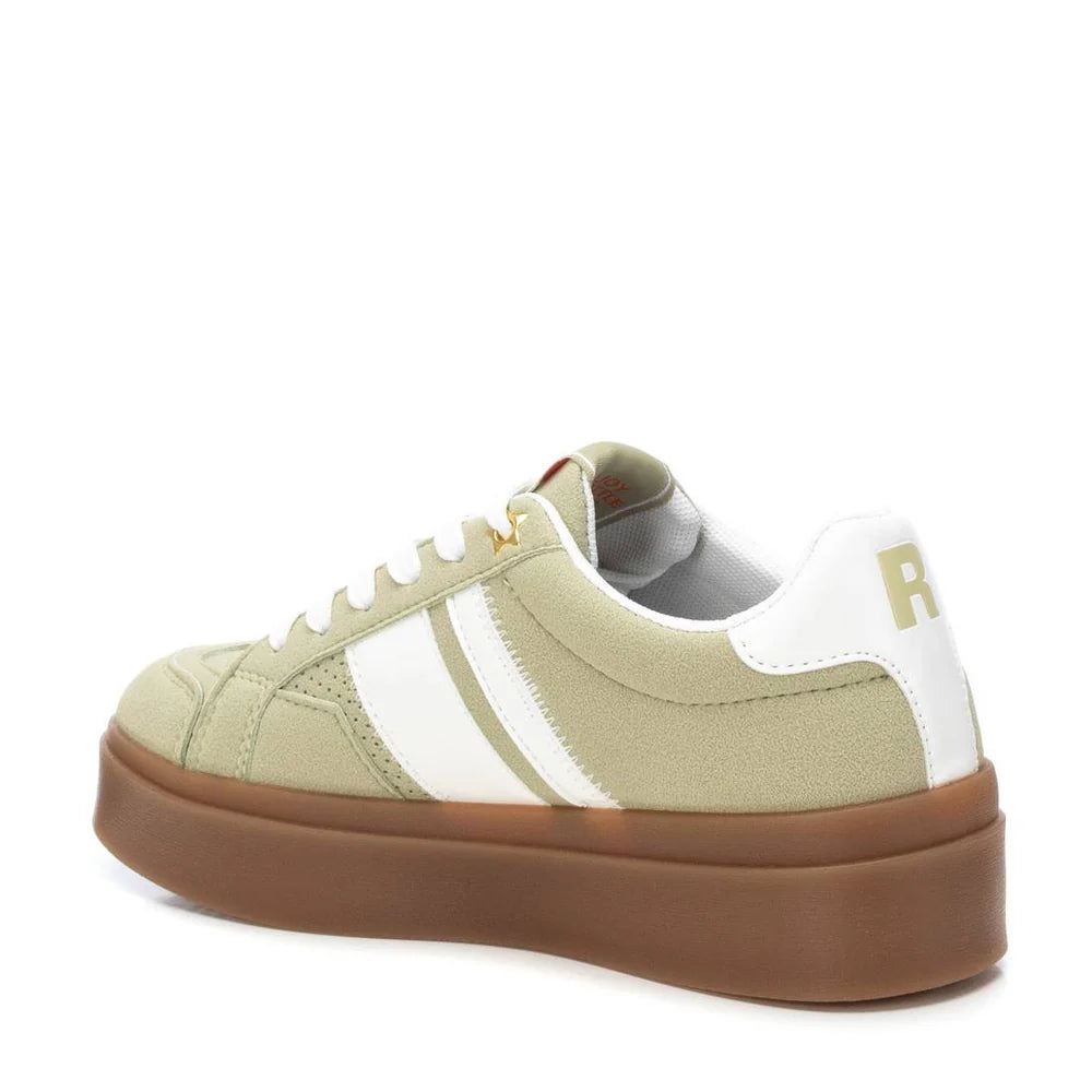 A green suede trainer with white stripes, white laces, a non-slip rubber sole, and a white heel tab featuring the letter R.