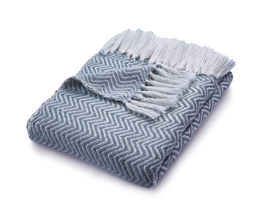 Eco-friendly Folded blue and white Herringbone Throw blanket made from recycled plastic bottles, featuring fringed edges.