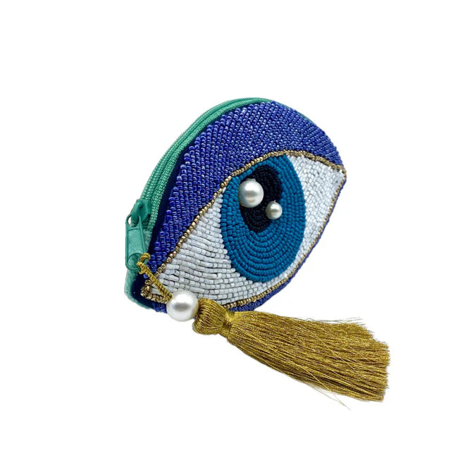 A small vegan-friendly coin purse featuring a beaded evil eye design, embellished with pearl beads and finished with a gold tassel on the zip—introducing your new Glimmer Eye Purse.