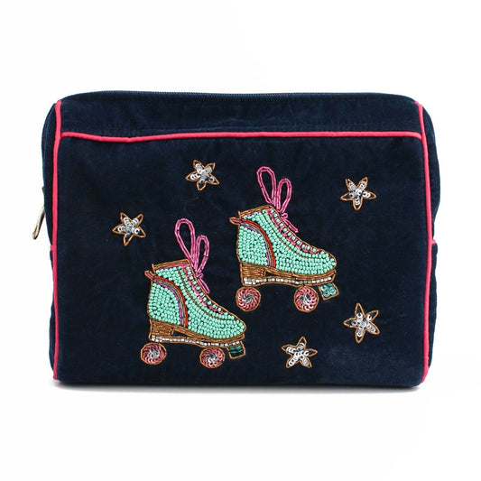 Handcrafted medium dark fabric pouch adorned with embroidered green roller skates and star designs, featuring a pink trim and zip.