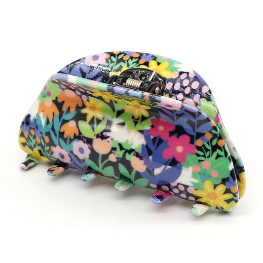 Luxury hair accessory: a floral-patterned hair claw clip crafted from premium acrylic, featuring multicoloured flowers and a sturdy metal spring hinge, elegantly displayed against a neutral background.