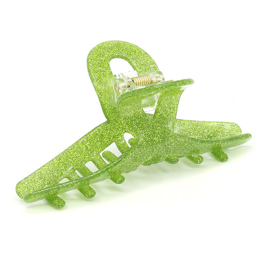 Vibrant lime glitter hair accessory featuring interlocking teeth and a spring hinge, this claw clip is isolated against a white background.