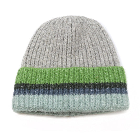 A ribbed beanie hat with a grey top and a folded brim in green, black, blue, and light blue stripes—this colourful beanie is the perfect warm knitted hat for chilly days.