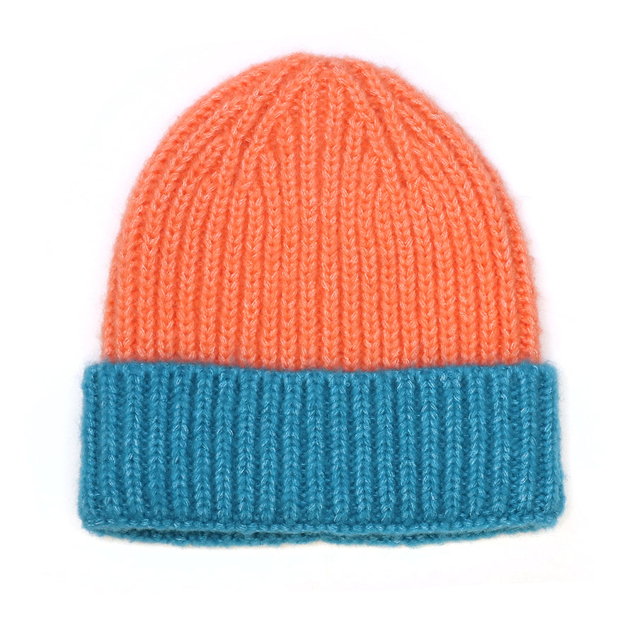 A cosy burnt orange beanie with a wide turquoise turn-up cuff, shown against a white background.