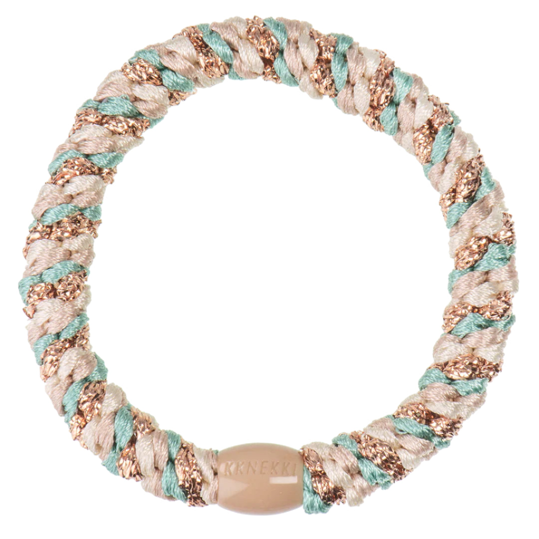 A Turkish Beige Glitter Hair Band with light brown, teal, and metallic copper strands, featuring a small beige clasp designed to prevent hair damage.