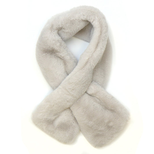A taupe faux fur pull-through scarf is laid flat on a white background with the ends crossed over each other—a luxurious winter accessory for effortless style.