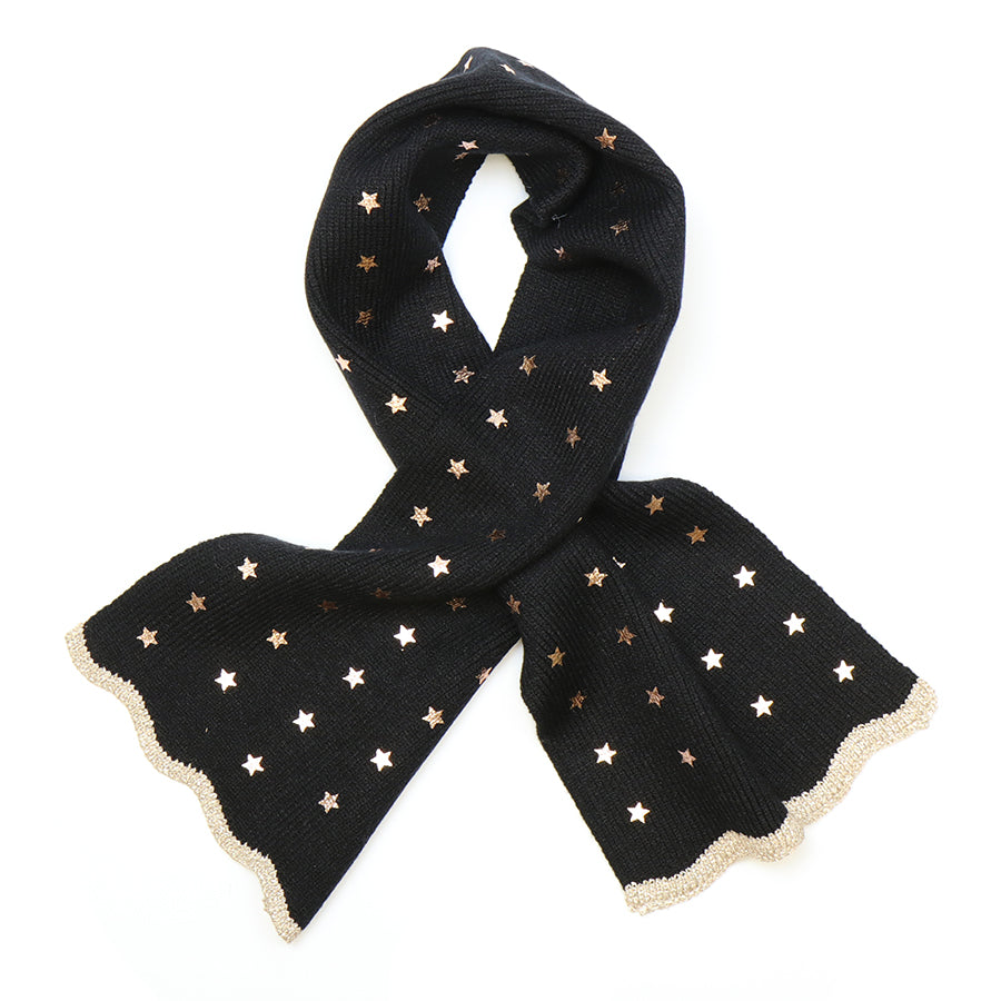 A black scarf made from recycled materials, featuring metallic gold star patterns and scalloped gold edging, displayed against a white background.