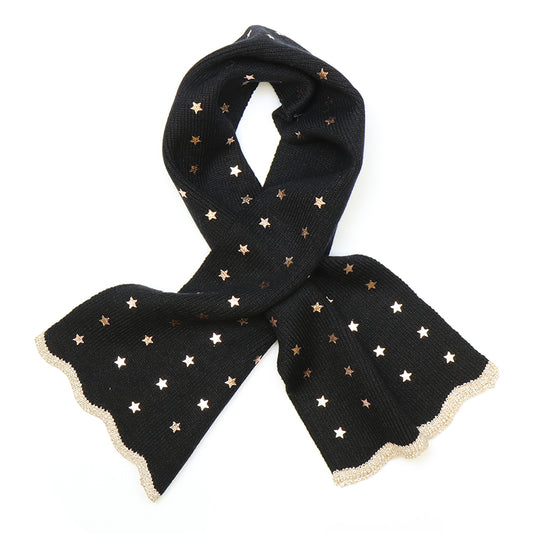 A black scarf made from recycled materials, featuring metallic gold star patterns and scalloped gold edging, displayed against a white background.