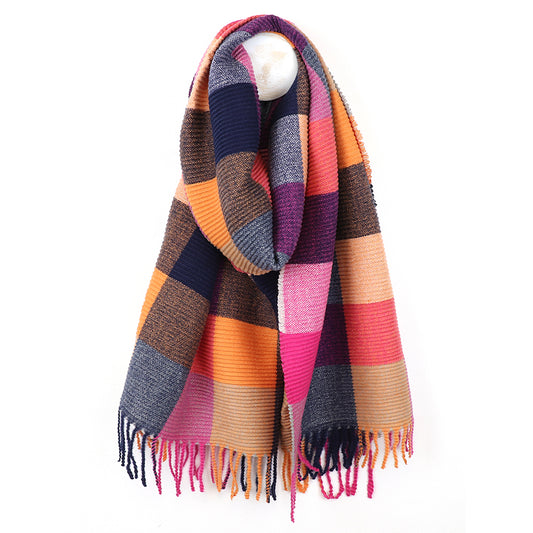A fashionable accessory, this crinkle check scarf showcases multicoloured checks in rust and pink, navy, beige, and purple with fringed ends, gracefully draped over a hanger against a white background.
