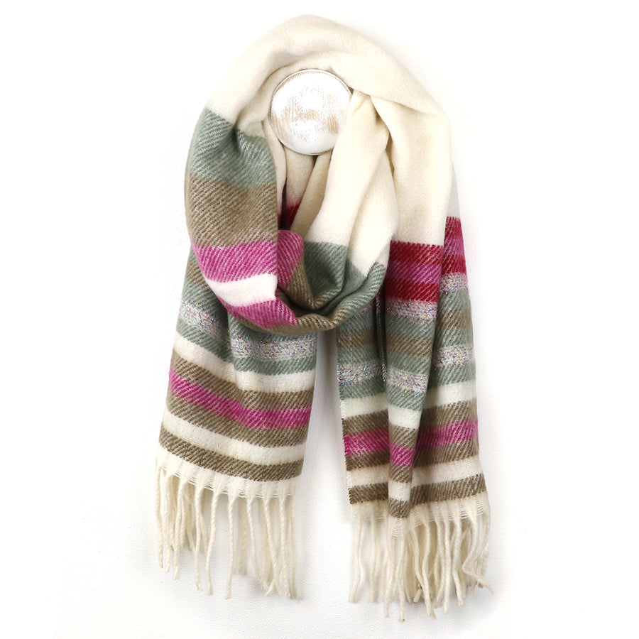 A twill-knit striped scarf featuring cream, green, olive, and pink stripes with fringed ends, shown hanging against a white background.