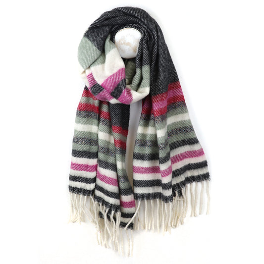 A pink and grey striped scarf with black, white, and green bands is displayed on a mannequin; its fringed ends hang down in a stylish twill knit.
