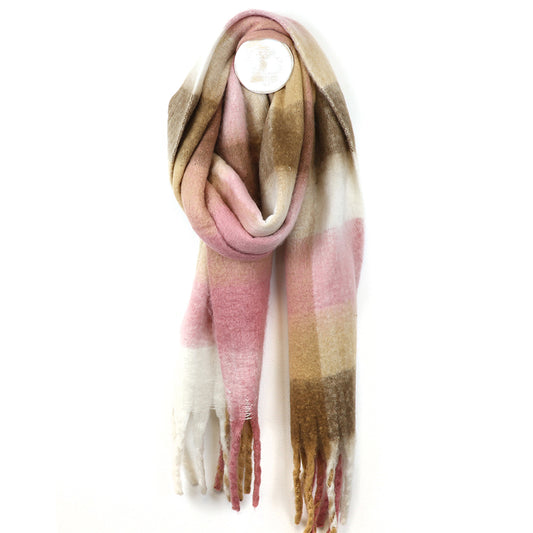 A long, soft pale pink chunky checked scarf with a plaid pattern in beige, brown and white tones, featuring fringed ends, shown against a white background.