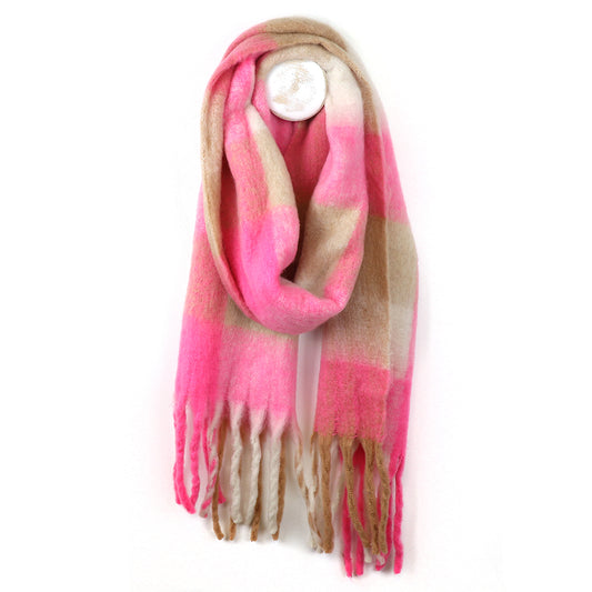 A cosy accessory, this chunky chequered scarf in pink, beige and cream with fringe at both ends hangs stylishly on a hook.