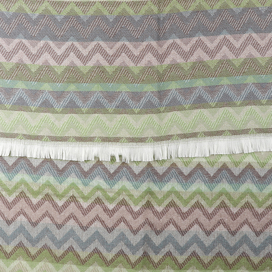 Fabric with a chevron striped pattern in muted green, brown, and blue tones, featuring a fringe along one edge—ideal for those who appreciate a unique multicoloured scarf.