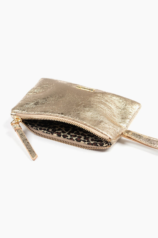 A small metallic gold clutch wristlet purse with a zipped fastening and wrist strap, shown partly open to reveal a leopard-print interior lining.