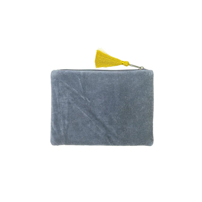 A rectangular grey velvet pouch with a zip fastening and yellow tassel, set against a white background—this vegan-friendly bag makes a stylish Christmas present.