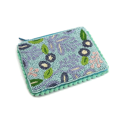 Teal beaded clutch with a floral and leaf pattern, featuring blue, green, and purple beads. Adorned with floral embellishments and a textured border, the design is enhanced by an aqua blue beading detail and a matching blue zip.