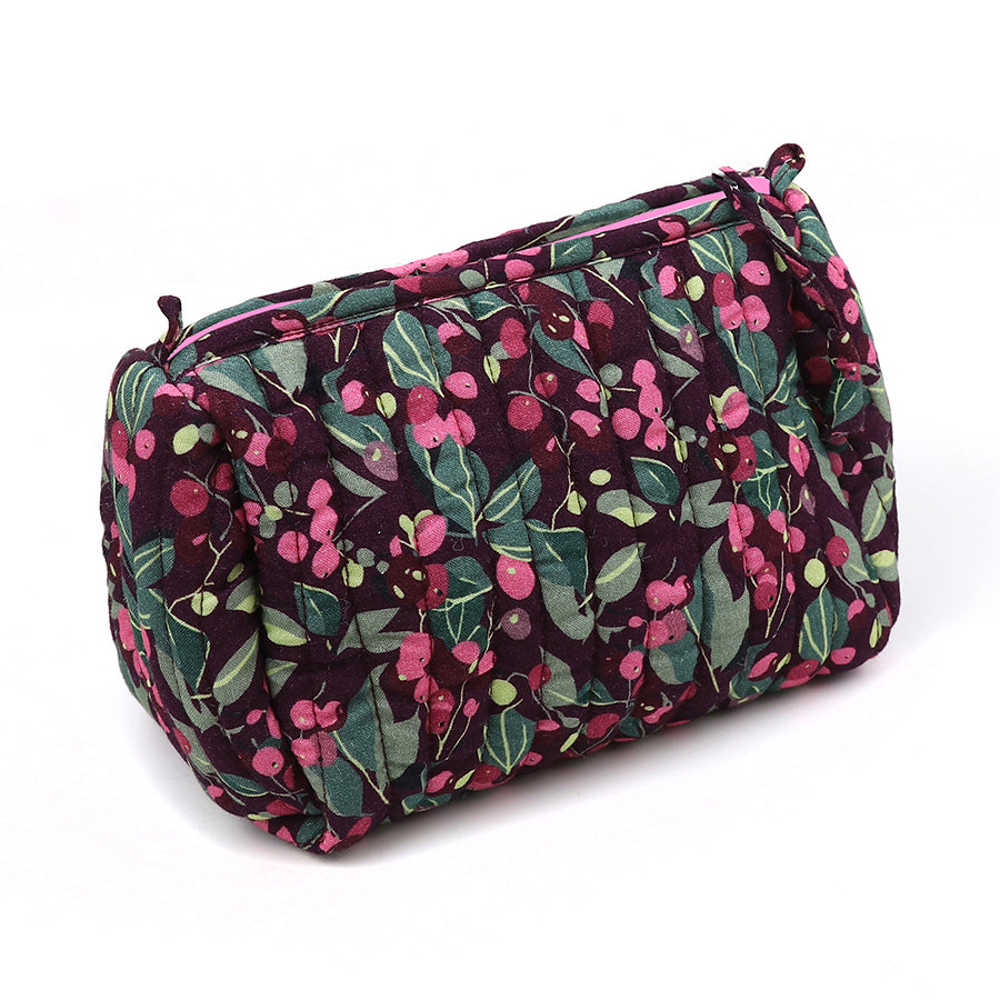 A quilted make-up bag with a zip, showcasing a deep purple background adorned with a green and pink floral design—ideal for keeping your beauty essentials. Presenting the delightful Winter Berry Quilted Make-up Bag.