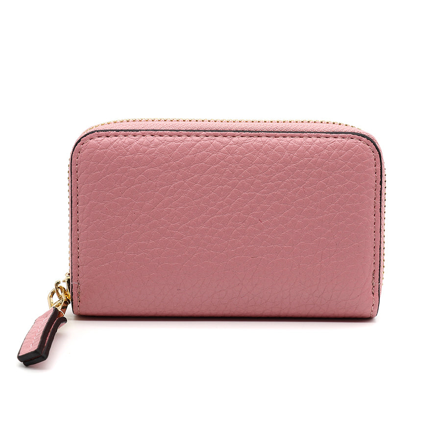 A small, pink leather wallet with a zip fastening and textured surface, featuring a gold zip pull. Its quilted style is reminiscent of a make-up bag, displayed against a white background.