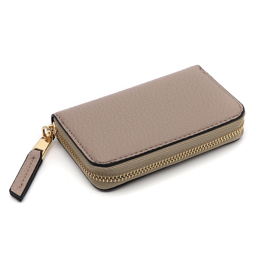 A beige leather zipped wallet with a gold zip and a matching beige and black pull tab, designed to complement any travel make-up bag, photographed against a white background.