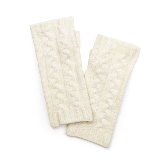 A pair of cream-coloured, cable-knit wrist warmers laid flat on a white background—ideal, vegan-friendly wrist warmers to keep your hands cosy and stylish.