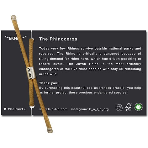 A card containing information on endangered rhinos, showcasing a tan hand-dyed bracelet and logos for environmental awareness and sustainability positioned at the bottom.