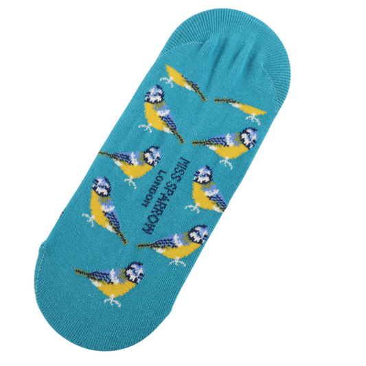 A turquoise Miss Sparrow sock featuring a pattern of yellow and blue birds, vegan-friendly construction, and the text LESS PIGEON LONDON. Rewritten in British English: A turquoise Miss Sparrow sock with a pattern of yellow and blue birds, a vegan-friendly make, and the wording LESS PIGEON LONDON.