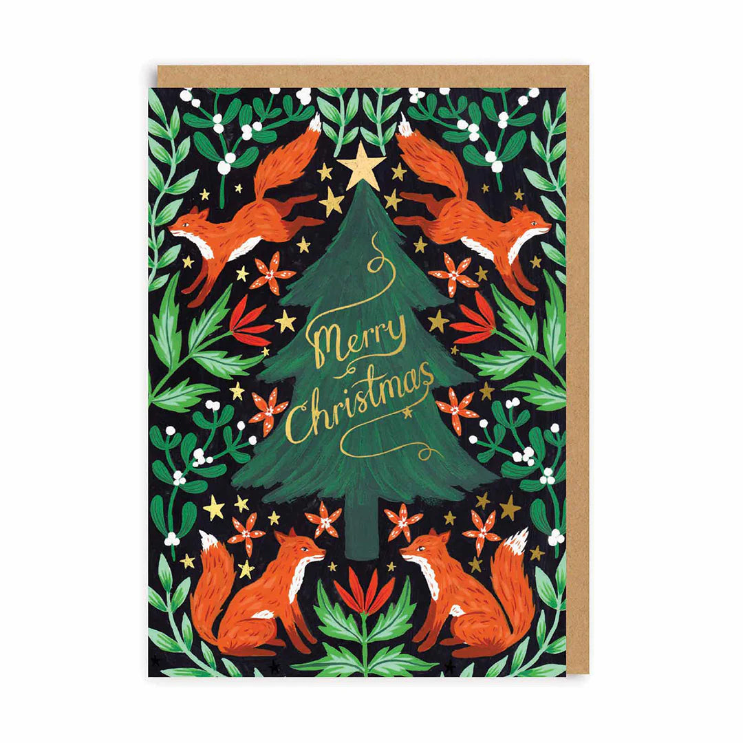 Illustrated fox Christmas card with a decorated tree bearing the words 'Merry Christmas', surrounded by four foxes, green leaves, red flowers, and gold stars—a delightful woodland festive card.