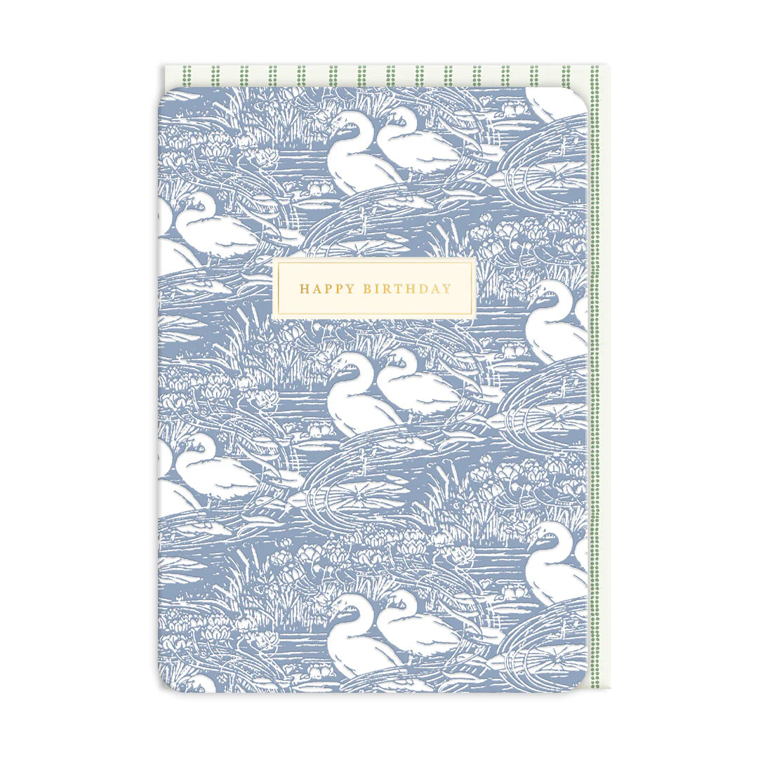 A Swan Birthday Card with a blue and white swan pattern and a beige rectangle in the centre displaying the birthday greeting, "Happy Birthday.