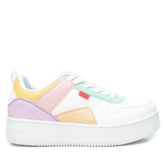 These Low Top Pastel Trainers boast a white trainer design with pastel-coloured panels in pink, yellow, orange, and green. Crafted from vegan leather, they rest on a chunky white rubber platform sole and are completed with classic white laces.
