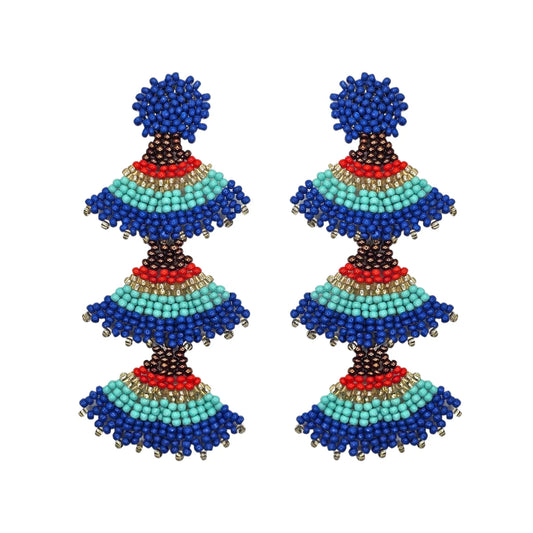 A pair of Red Triple Fan Drop Earrings crafted from small Capri Blue Mix, turquoise, red, brown and gold beads arranged in a layered pattern, featuring surgical steel posts set against a white background.