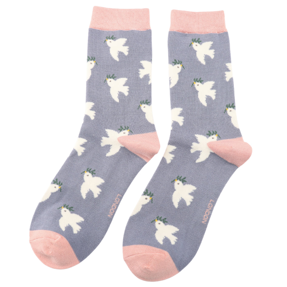 A pair of light purple Doves Denim Socks with pink toes, heels, and cuffs, featuring a pattern of white doves with green leaves. Made from bamboo and cotton, they fit UK sizes 3–7.