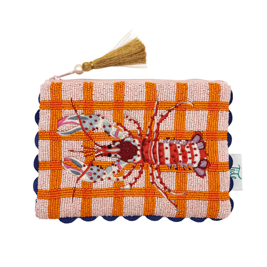 Hand-crafted pouch with an embroidered red lobster on an orange and pink chequered background, navy scalloped edges, and a tassel zip pull—a cheerful vegan-friendly accessory.