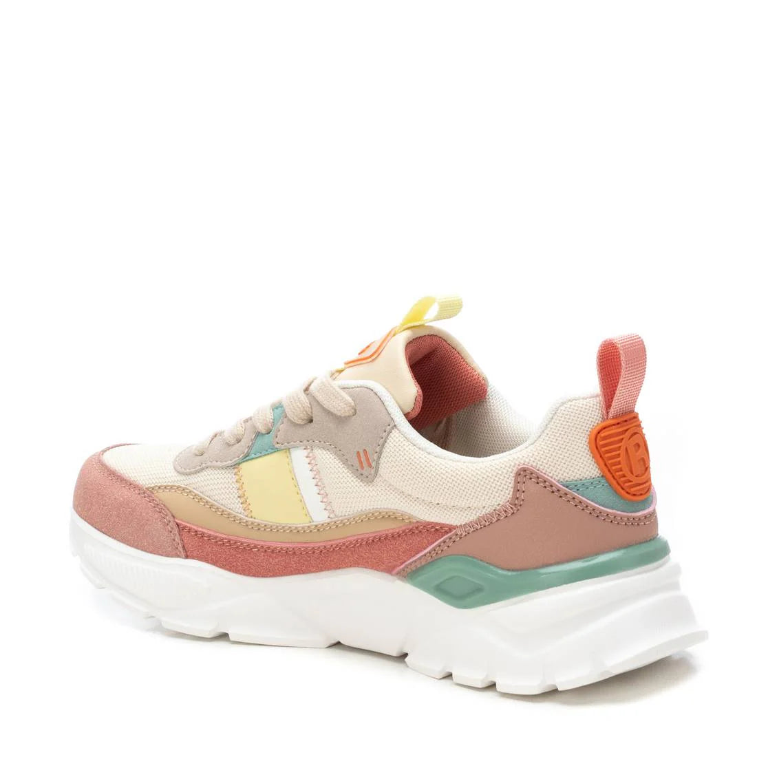 A beige multi-colour trainer with a thick white non-slip rubber sole, featuring beige, pink, mint green, orange and yellow details, shown at an angle on a white background.