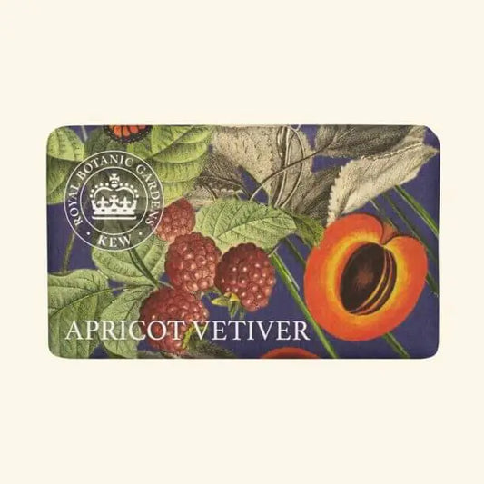 A rectangular Apricot Vetiver Soap bar, bearing a Royal Botanic Gardens Kew seal, displays illustrations of apricots, raspberries, and leaves. This vegan soap is gentle and environmentally friendly.