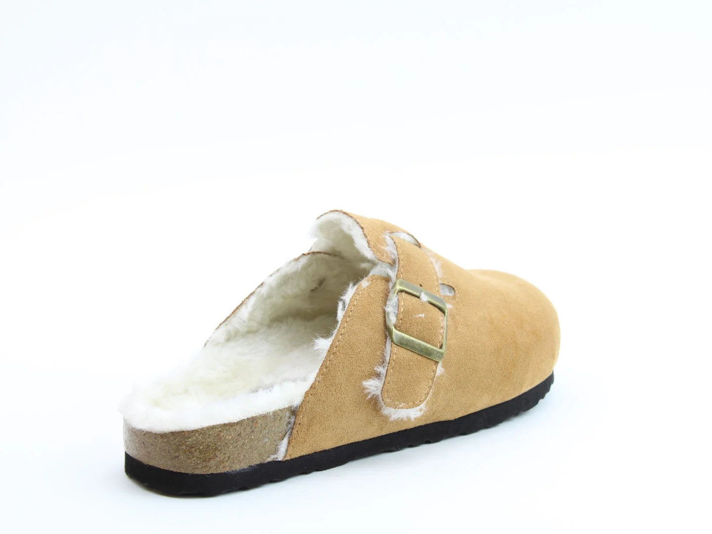 A single tan suede slipper with a faux fur lining and black sole, featuring a metal buckle on the side and a contoured footbed for added comfort.