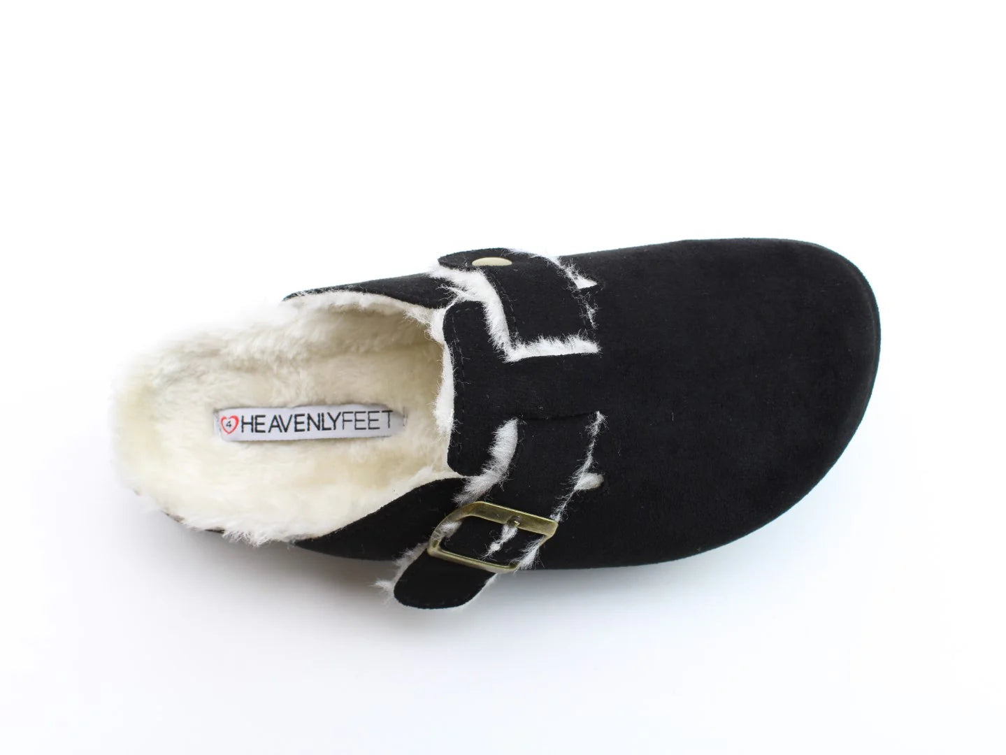 Black slip-on shoe with contoured footbed and cosy faux fur lining, featuring a buckle strap. Brand label Heavenly Feet visible inside.