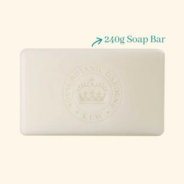 A rectangular white Kew Gardens Geranium and Basil Soap bar featuring an embossed crown logo and Royal Botanic Gardens, Kew lettering, marked as a 240g vegan-friendly soap.