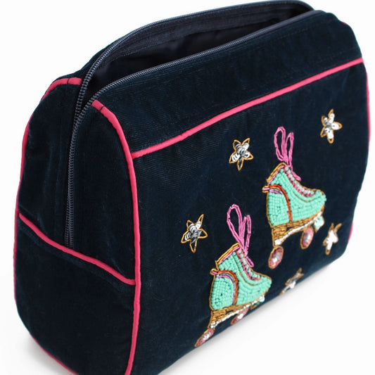 Handcrafted medium pouch in blue velvet with a pink zip and piping, adorned with embroidered roller skates and star designs.