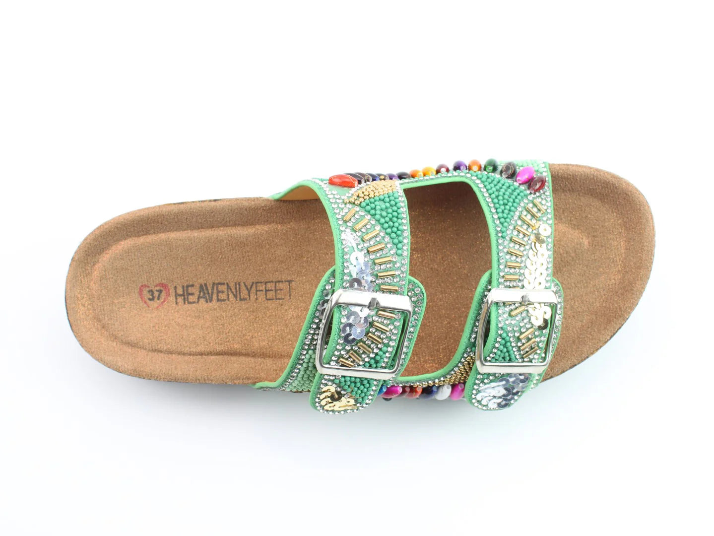 A vegan-friendly green sandal with two straps, silver buckles, multicoloured bead and gem embellishments, and a cork sole labelled Heavenly Feet in size 37.