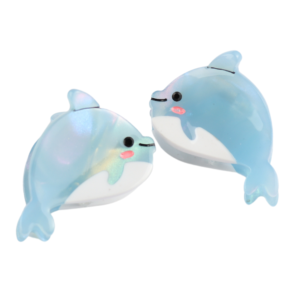 Two cartoon-style blue dolphins with pink cheeks face each other against a white background, embodying the playful charm of Dolphin Hair Claw Clips—a durable and stylish hair accessory.