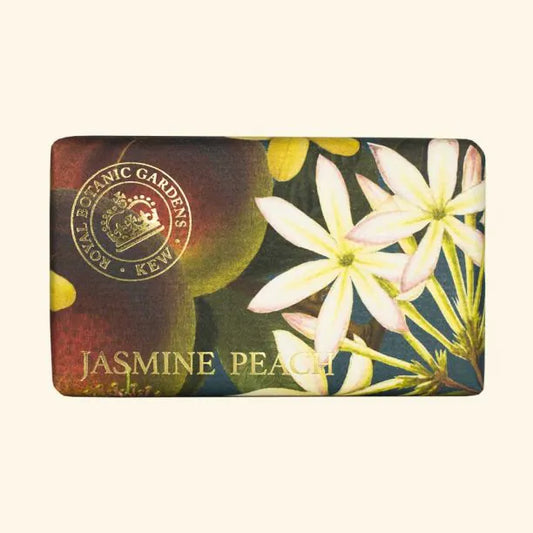 A rectangular bar of Kew Gardens Jasmine Peach Soap, adorned with floral and fruit illustrations and featuring a Royal Botanic Gardens Kew emblem—a perfect eco-friendly gift.