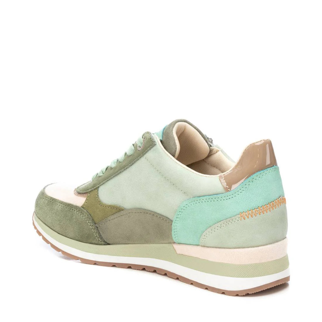 A green and beige trainer with suede and leather panels, a tan rubber sole, and mint green and nude accents, viewed from the rear side angle—perfect vegan-friendly trainers for everyday style.