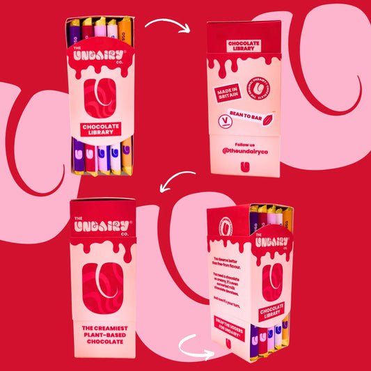 Four views of a pink and red box labelled The Udairy Co. Chocolate Library, containing several gift-worthy, non-dairy chocolate bars with colourful wrappers.