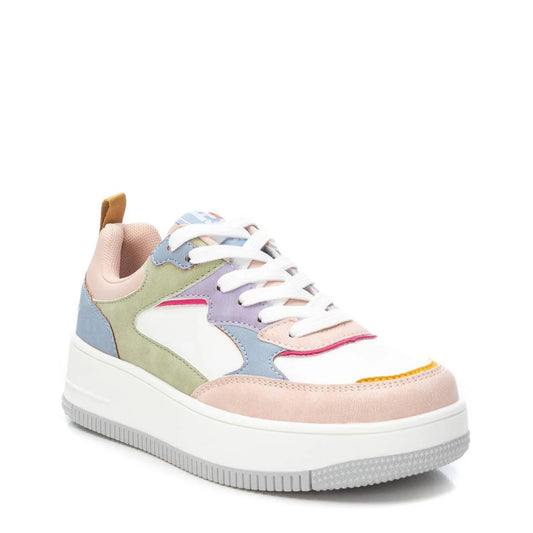 A multicoloured trainer with white laces, a thick rubber sole, and pastel panels in blue, green, pink, purple, yellow and beige—these are stylish vegan trainers that are also PETA certified.