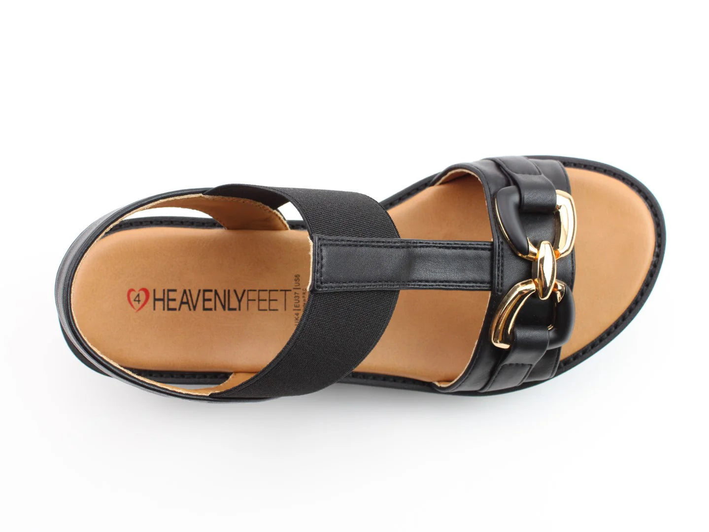 Black sandal with gold buckles and a tan sole, branded Heavenly Feet. Top view. Crafted with lightweight Litesoles for all-day comfort, these Lulu2 Sandals are also vegan-friendly, offering style and sustainability in one perfect pair.