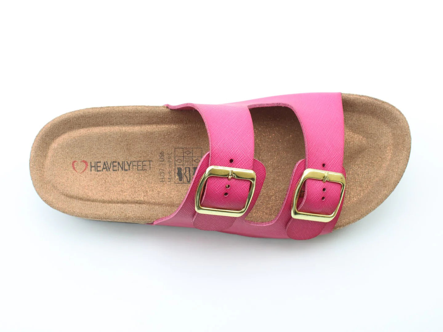 The vegan-friendly Harmony2 Sandal is a pink delight featuring two gold buckles and a cork footbed, proudly displaying the Heavenly Feet branding on the insole.